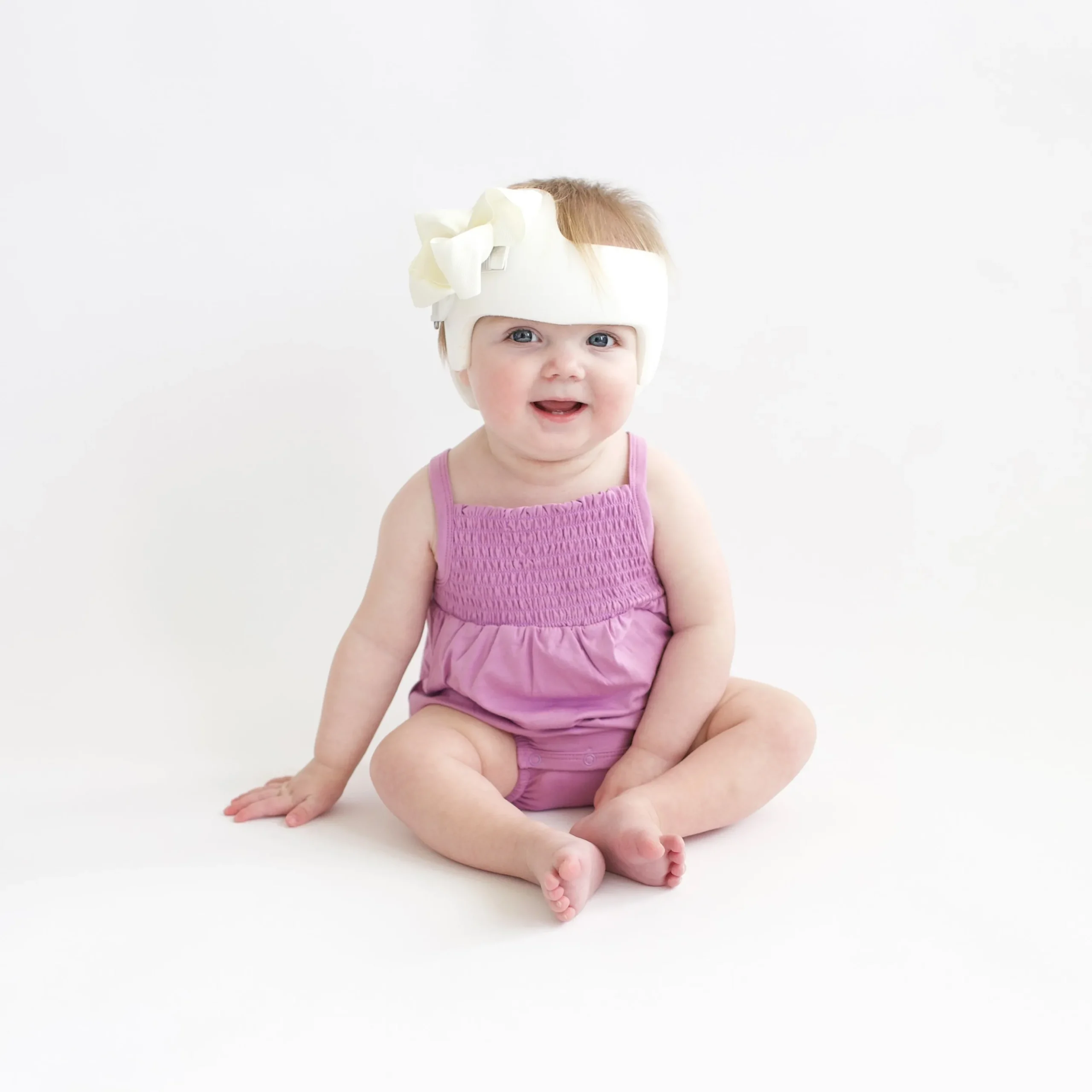 Smocked Bubble Romper in Poi